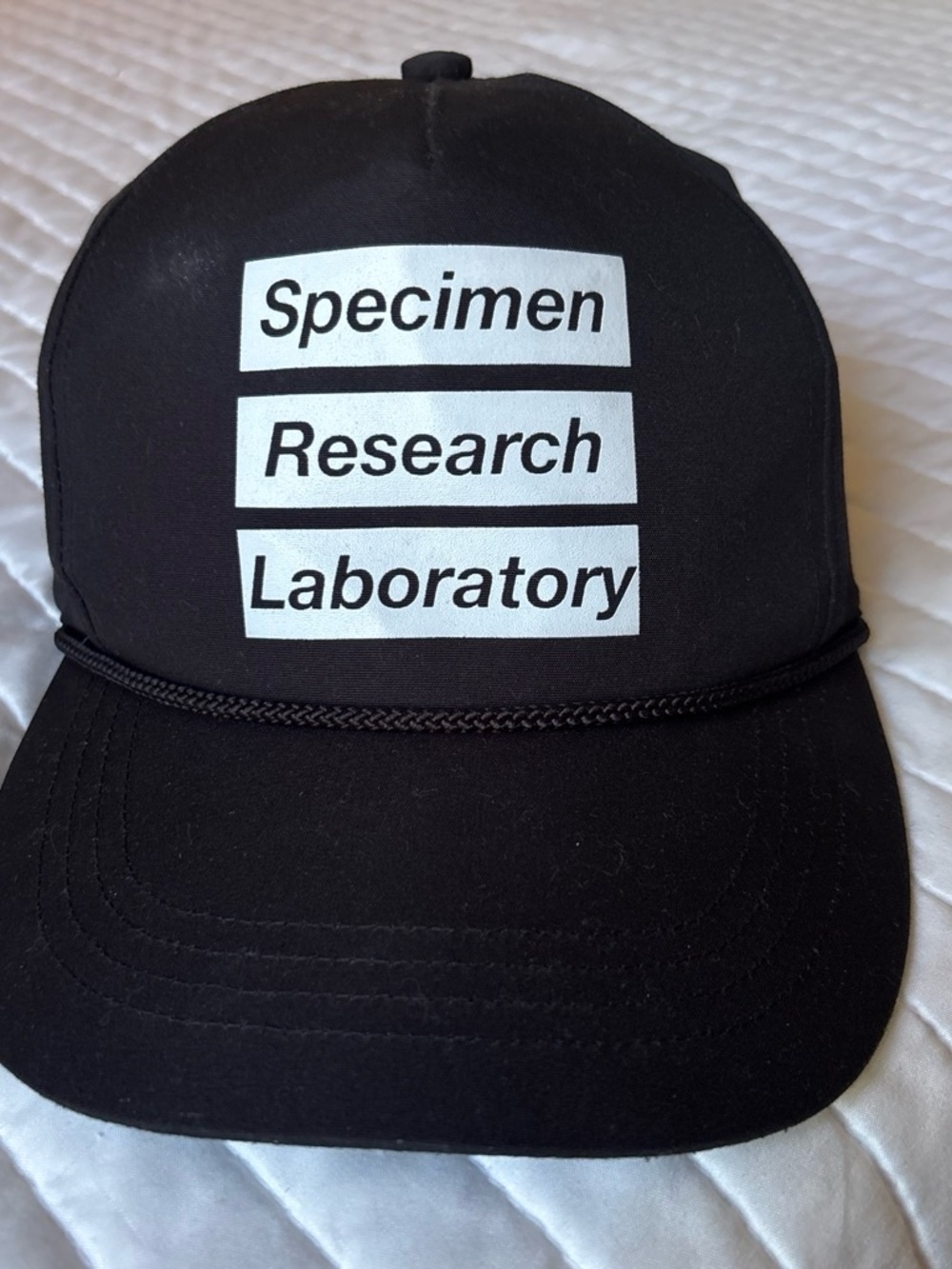 Neighborhood Black Trucker Hat with White Text Panels